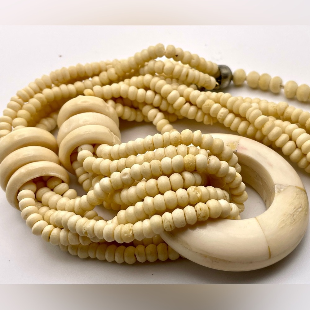 Carved  multi strand bone beaded necklace pendant 131 grams.